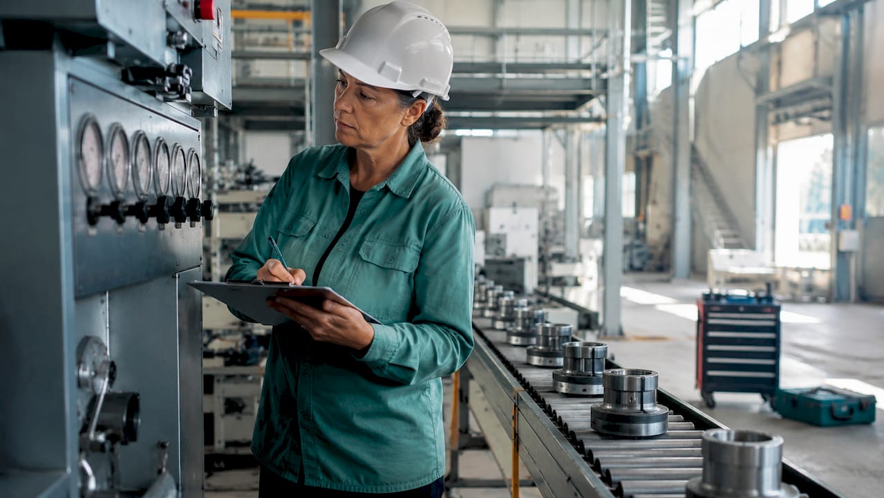Engineer inspecting manufacturing quality process